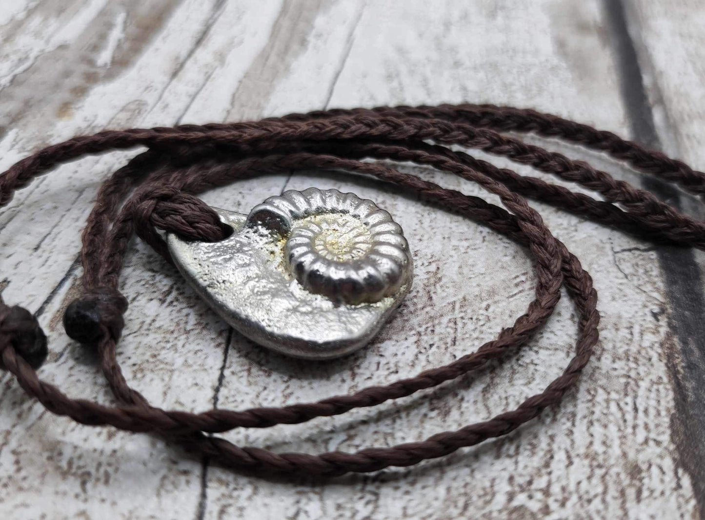 Pewter metal cast ammonite pendant.