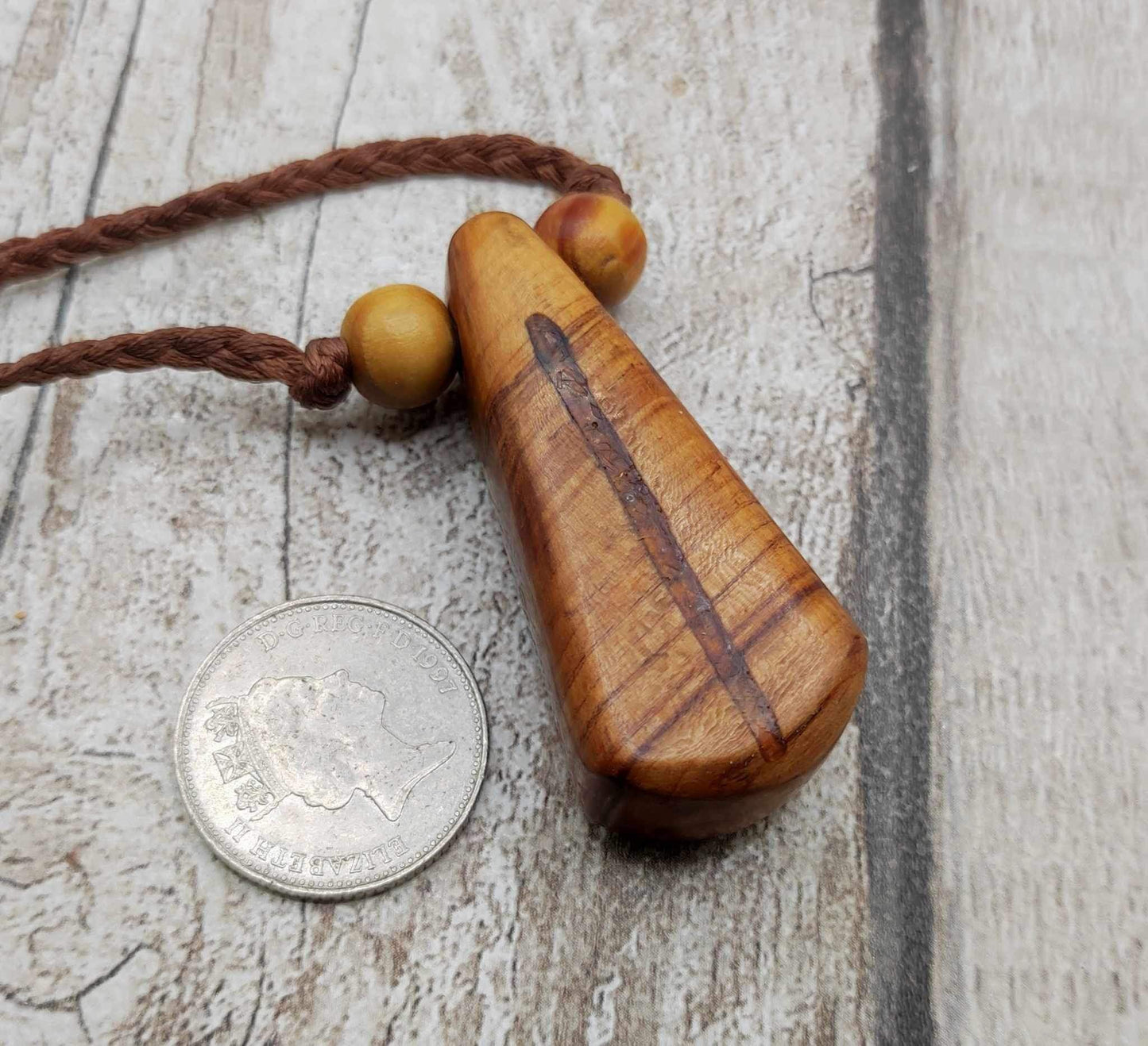 New Zealand Rimu wood and kauri copal gum pendant