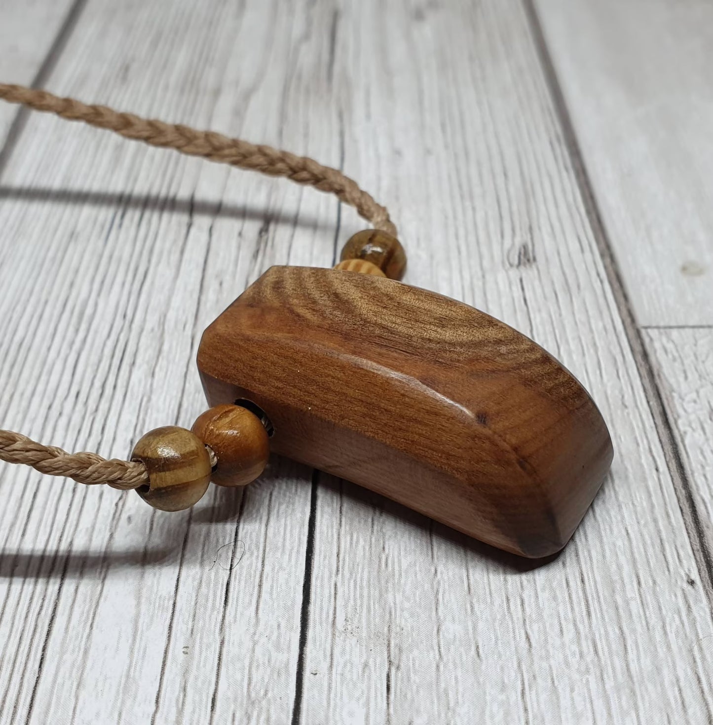 New Zealand Rimu wood unisex pendant.