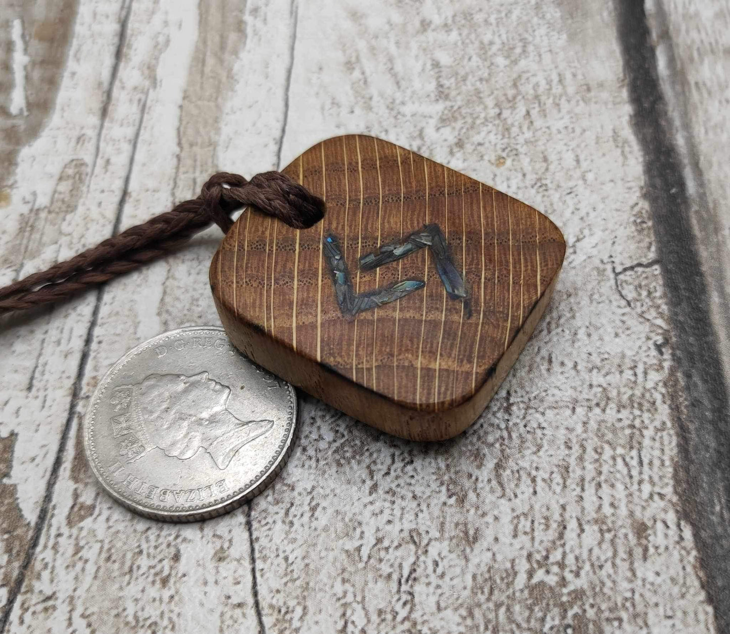 Oak wood jera Viking rune Christmas decoration with Pāua shell.