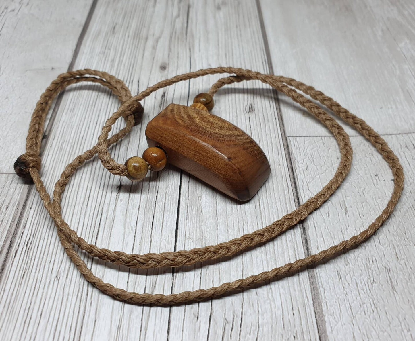 New Zealand Rimu wood unisex pendant.