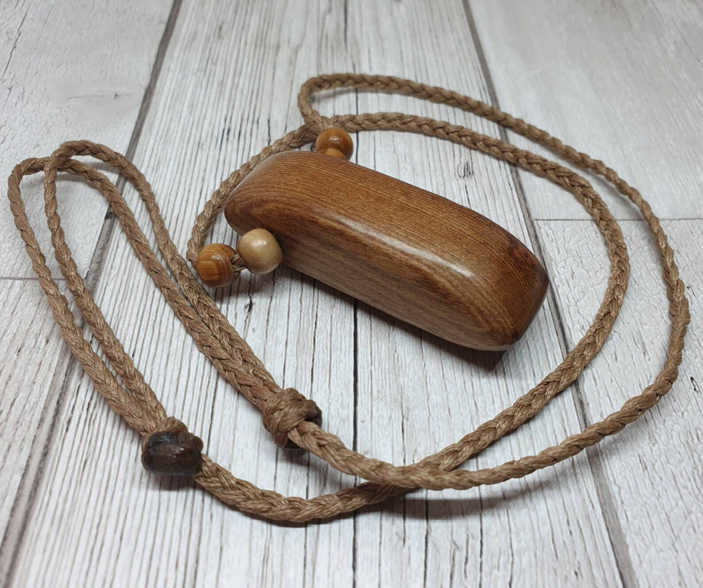 New Zealand Rimu wood adze inspired pendant.