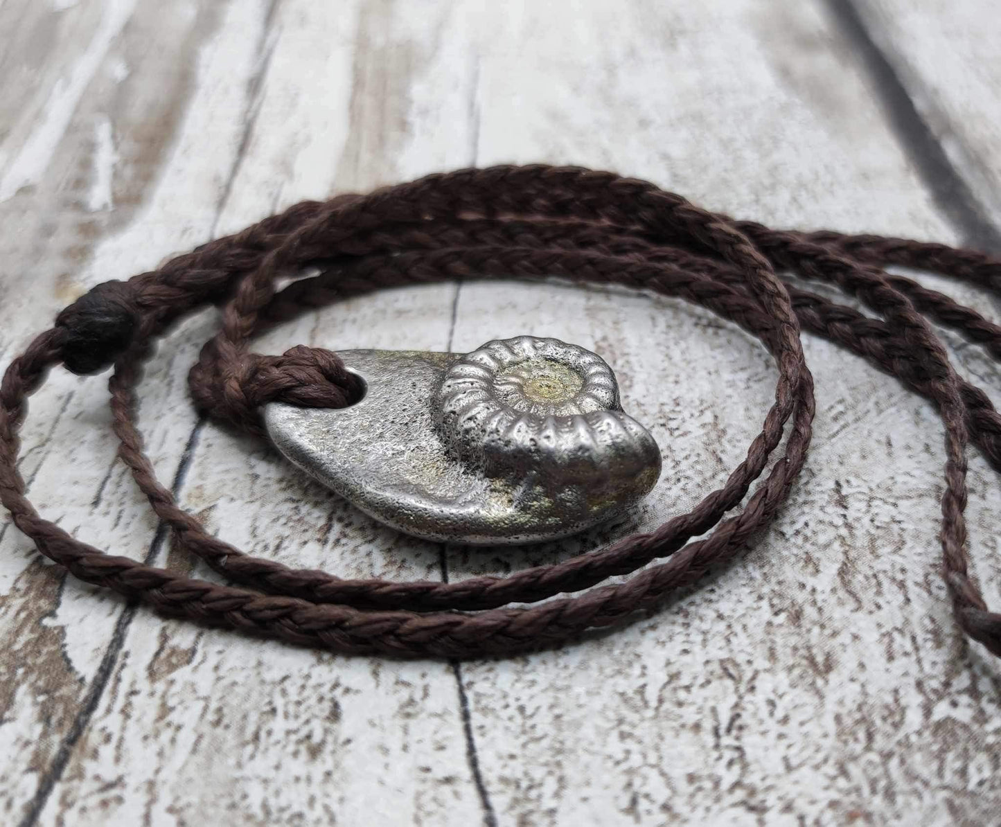 Pewter metal casting ammonite spiral pendant.