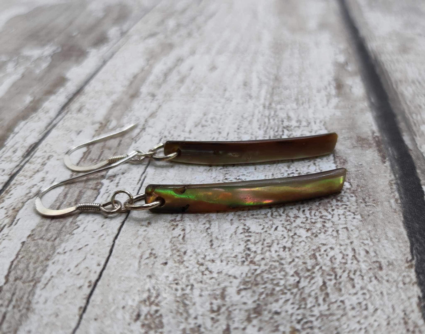 New Zealand rainbow Pāua shell Toki styled dangle earrings.