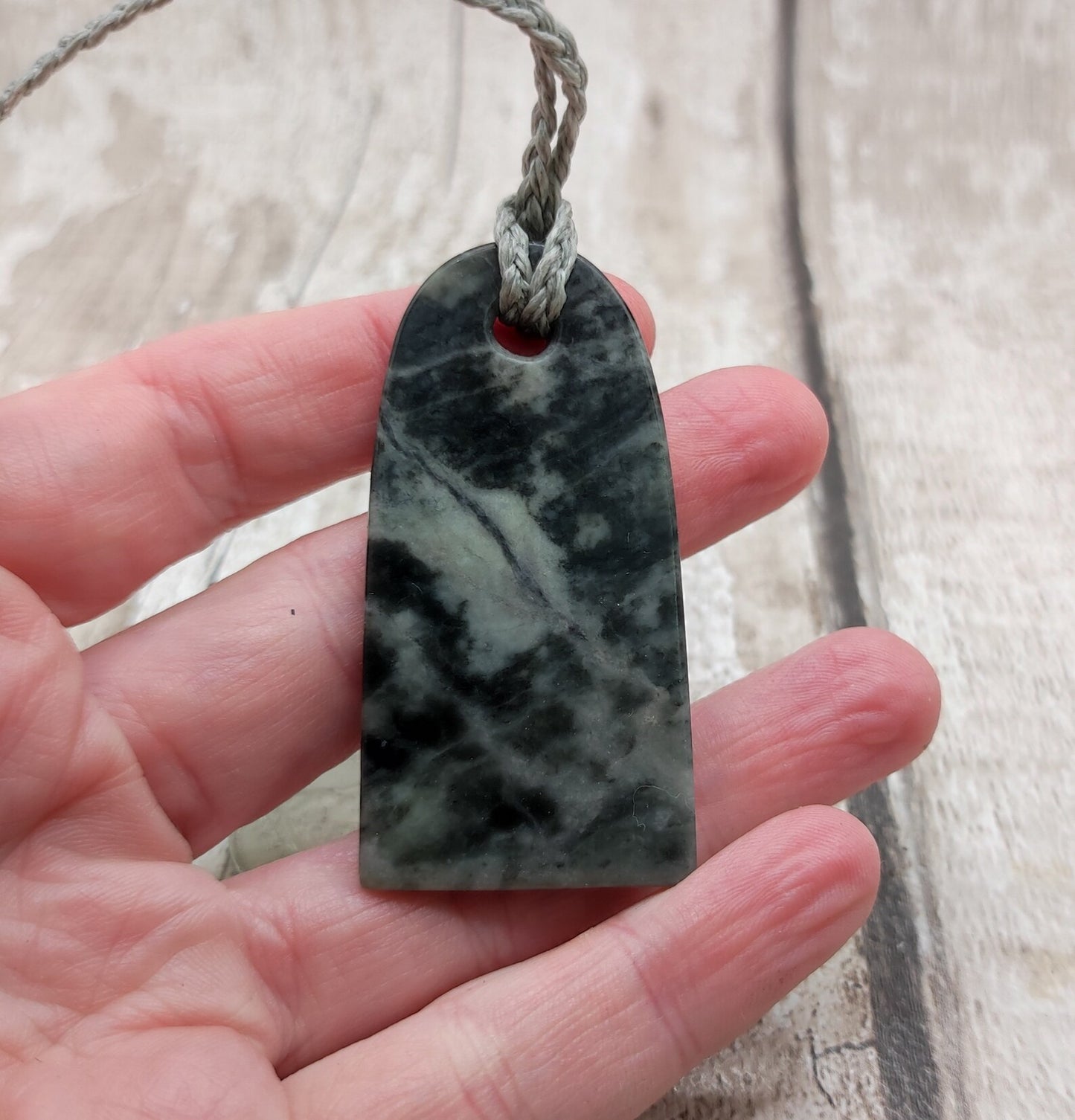 Alaskan nephrite jade Toki styled pendant with mussel shell inlay.