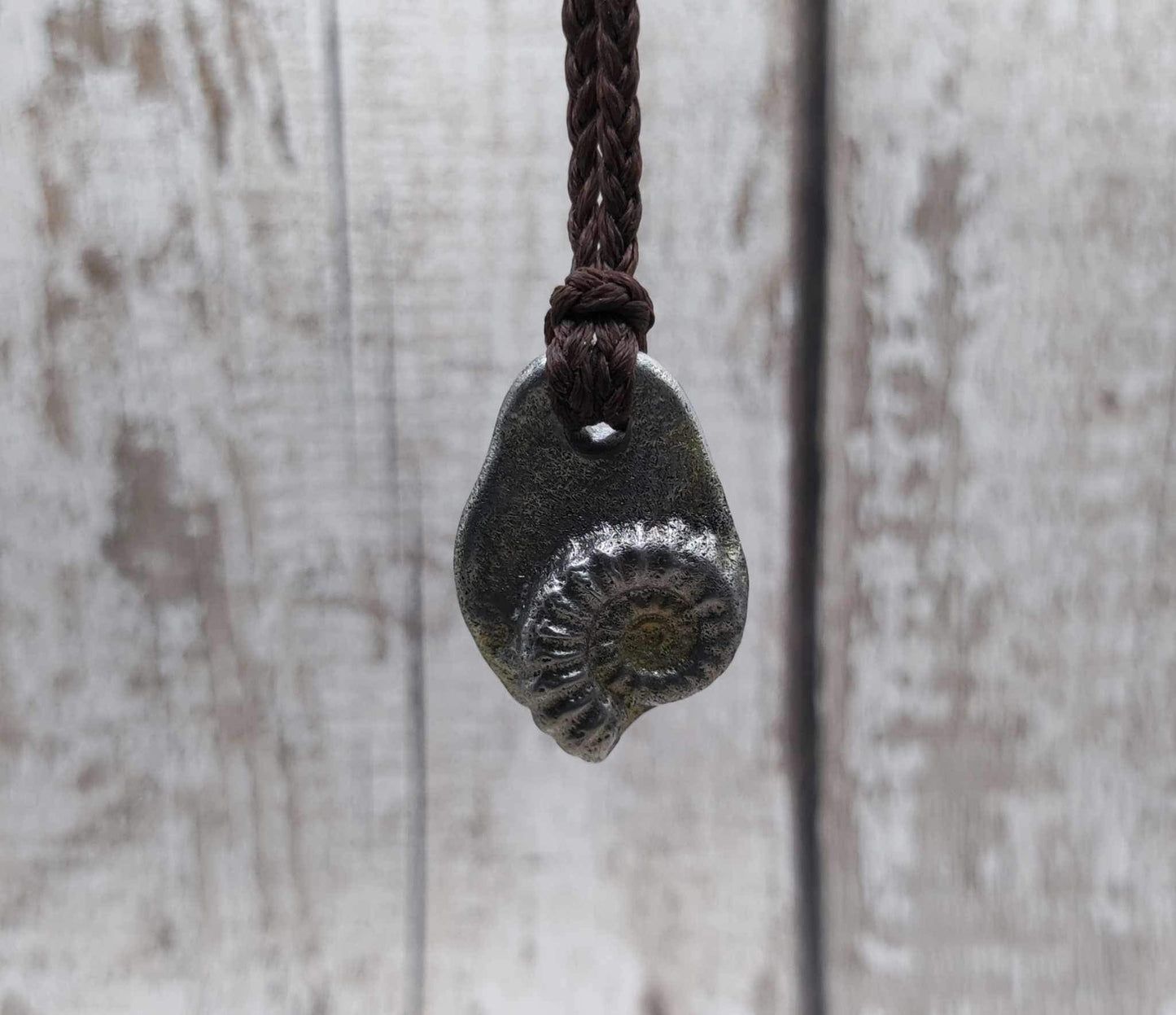 Pewter metal casting ammonite spiral pendant.