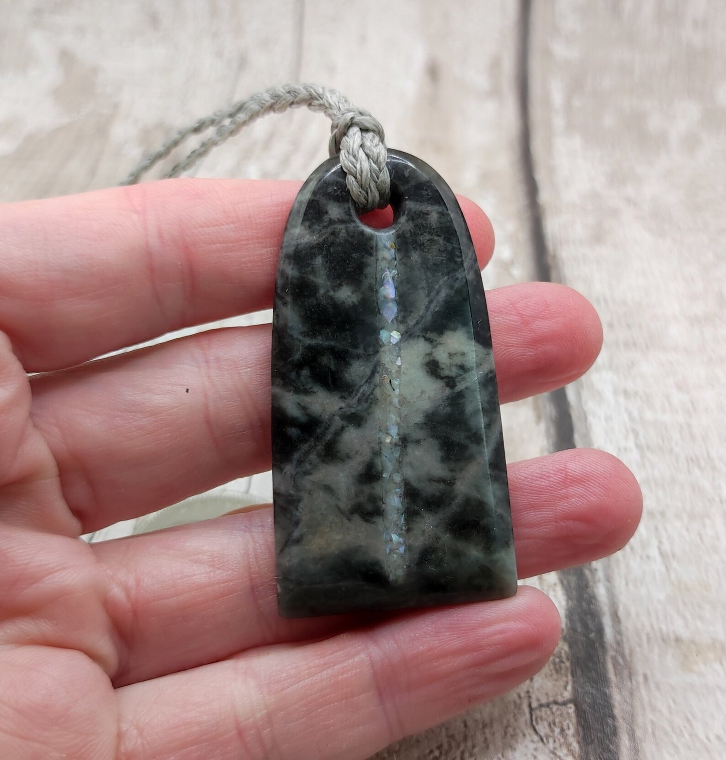 Alaskan nephrite jade Toki styled pendant with mussel shell inlay.