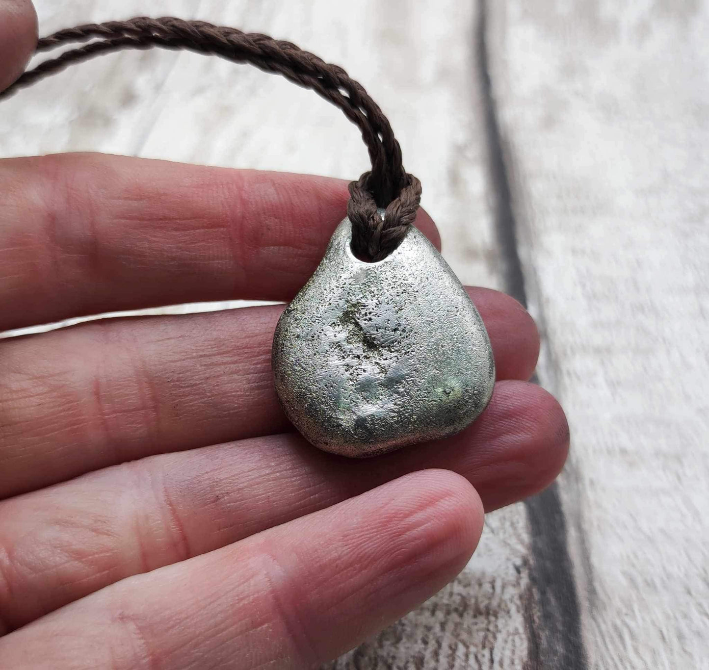 Pewter metal cast ammonite pendant.