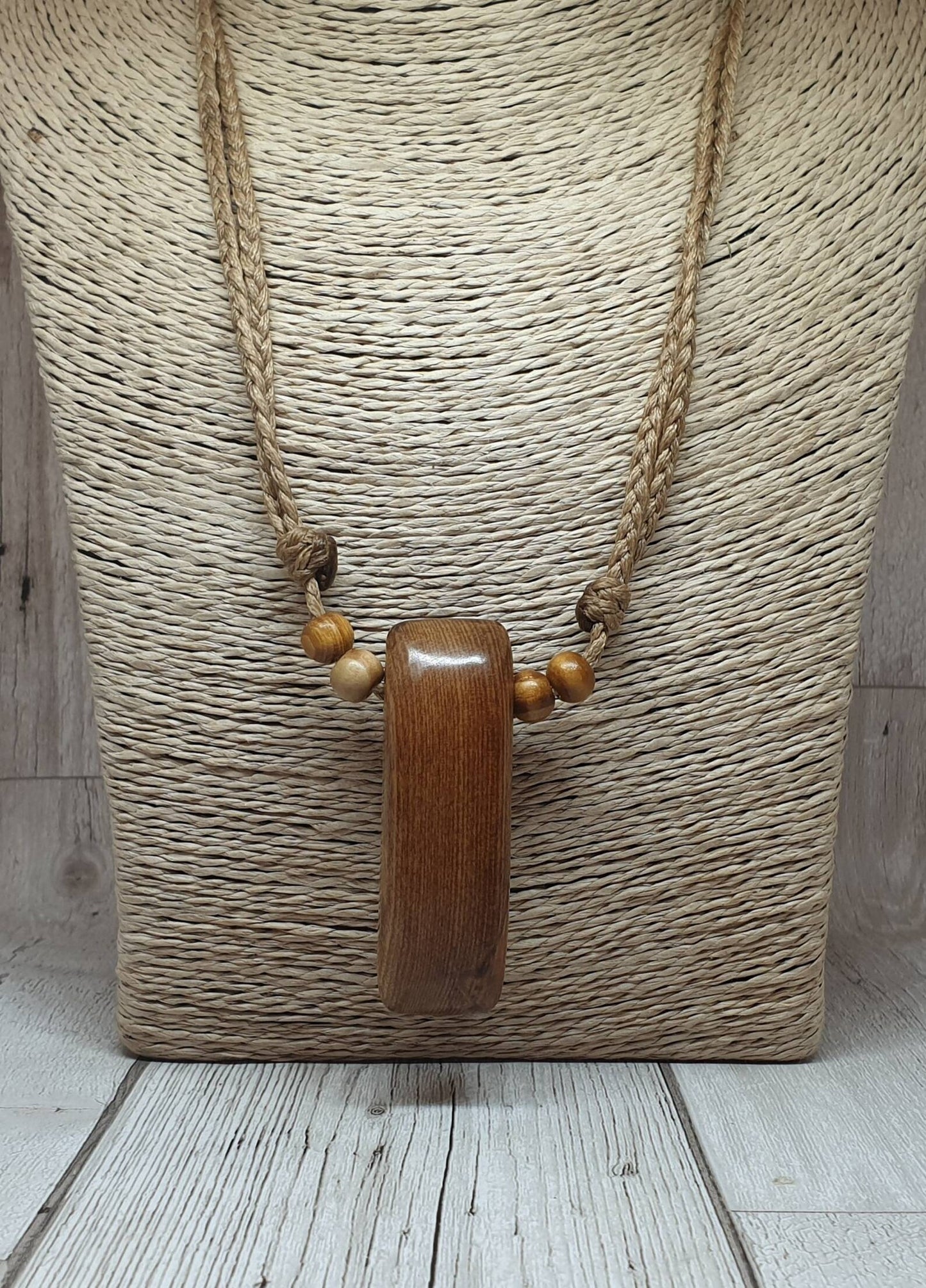 New Zealand Rimu wood adze inspired pendant.