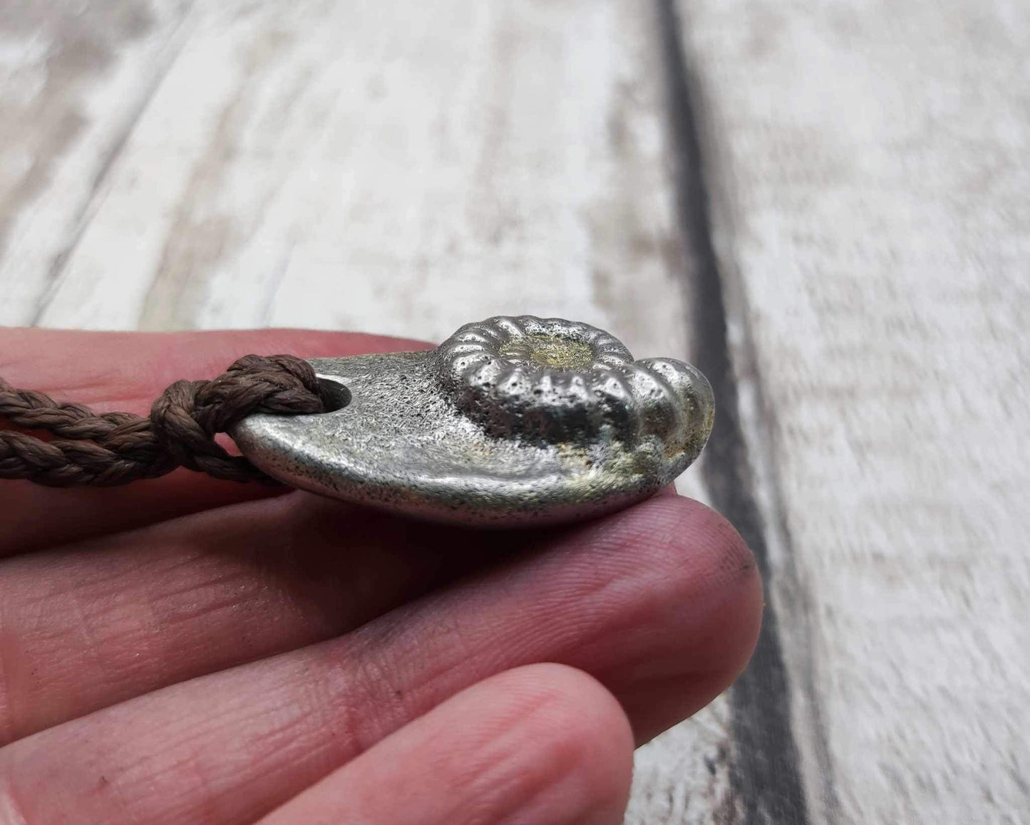 Pewter metal casting ammonite spiral pendant.