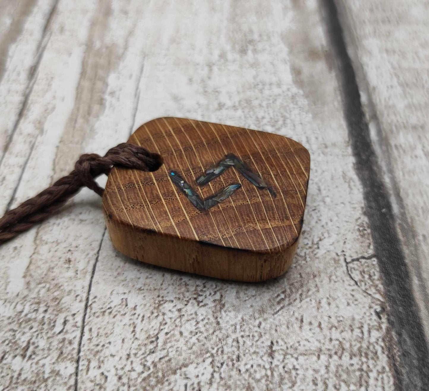 Oak wood jera Viking rune Christmas decoration with Pāua shell.