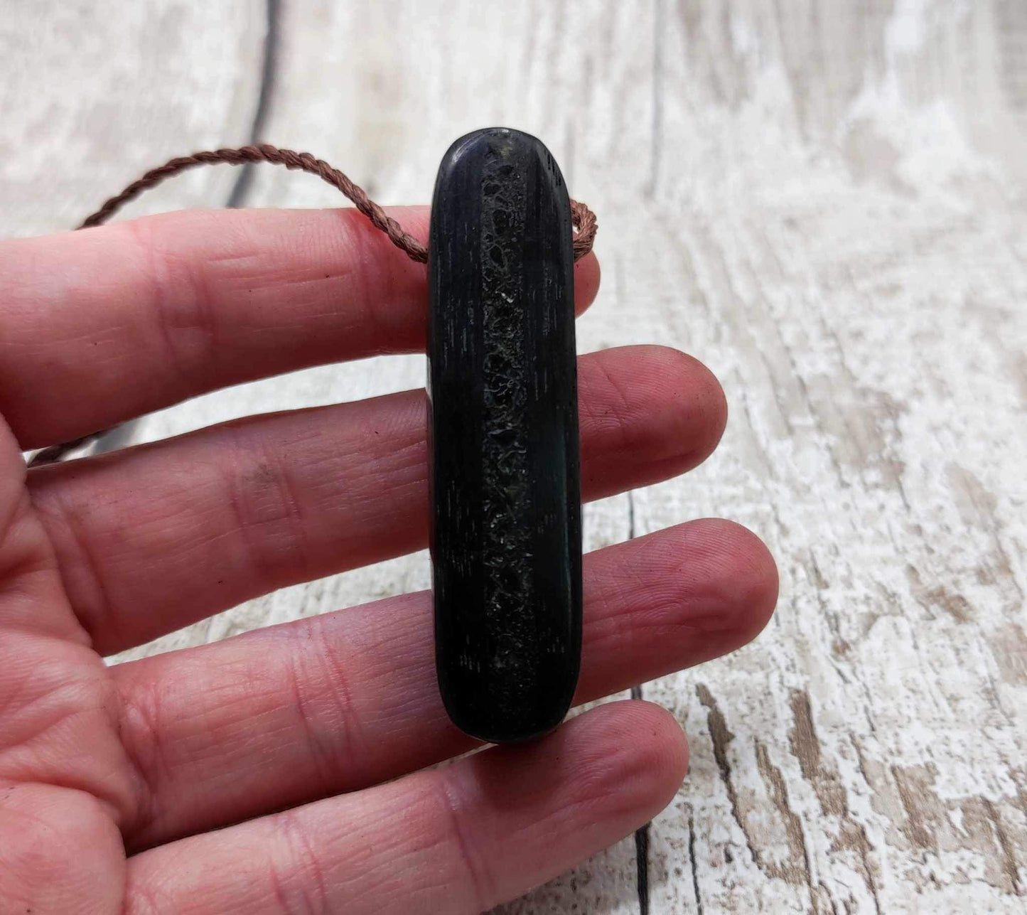 Bog oak and moldavite glass,