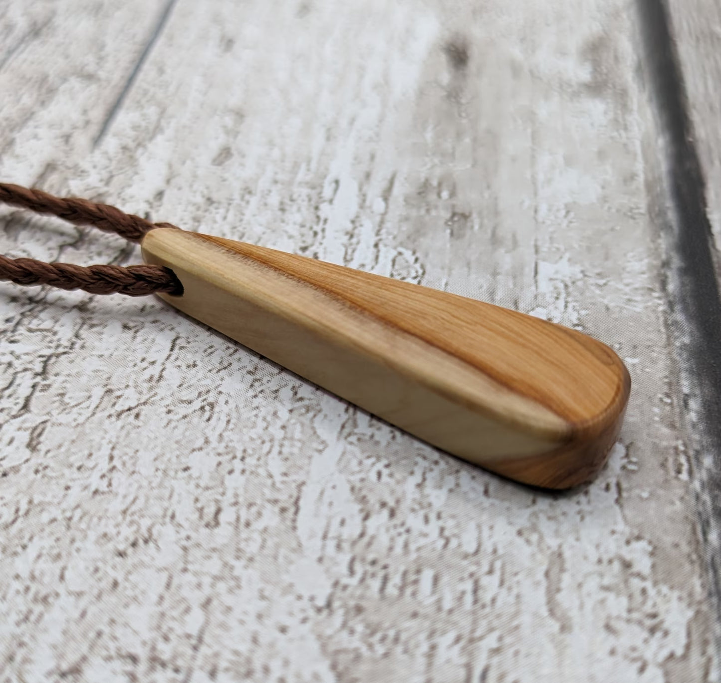 Yew wood roimata drop pendant.