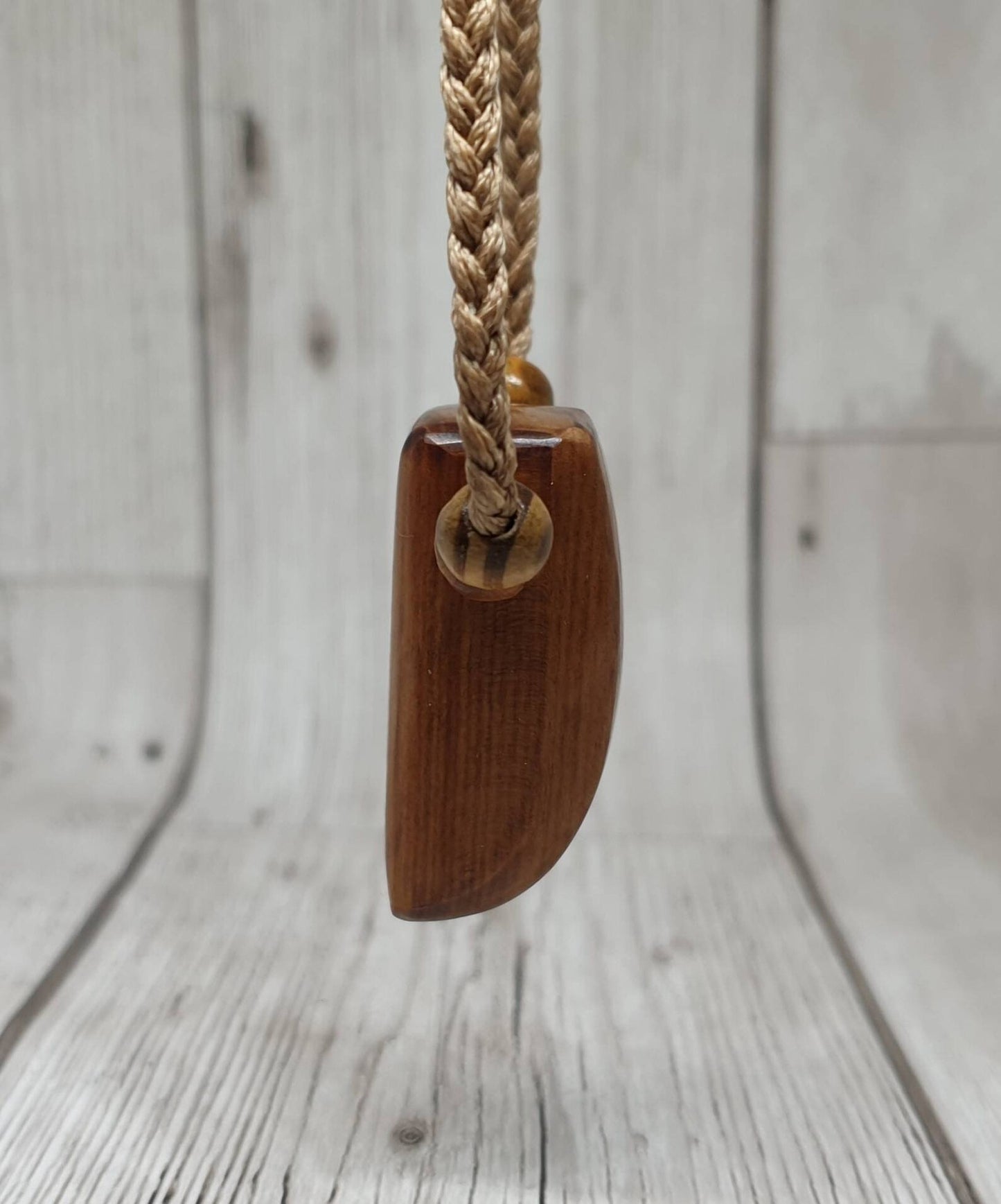 New Zealand Rimu wood unisex pendant.