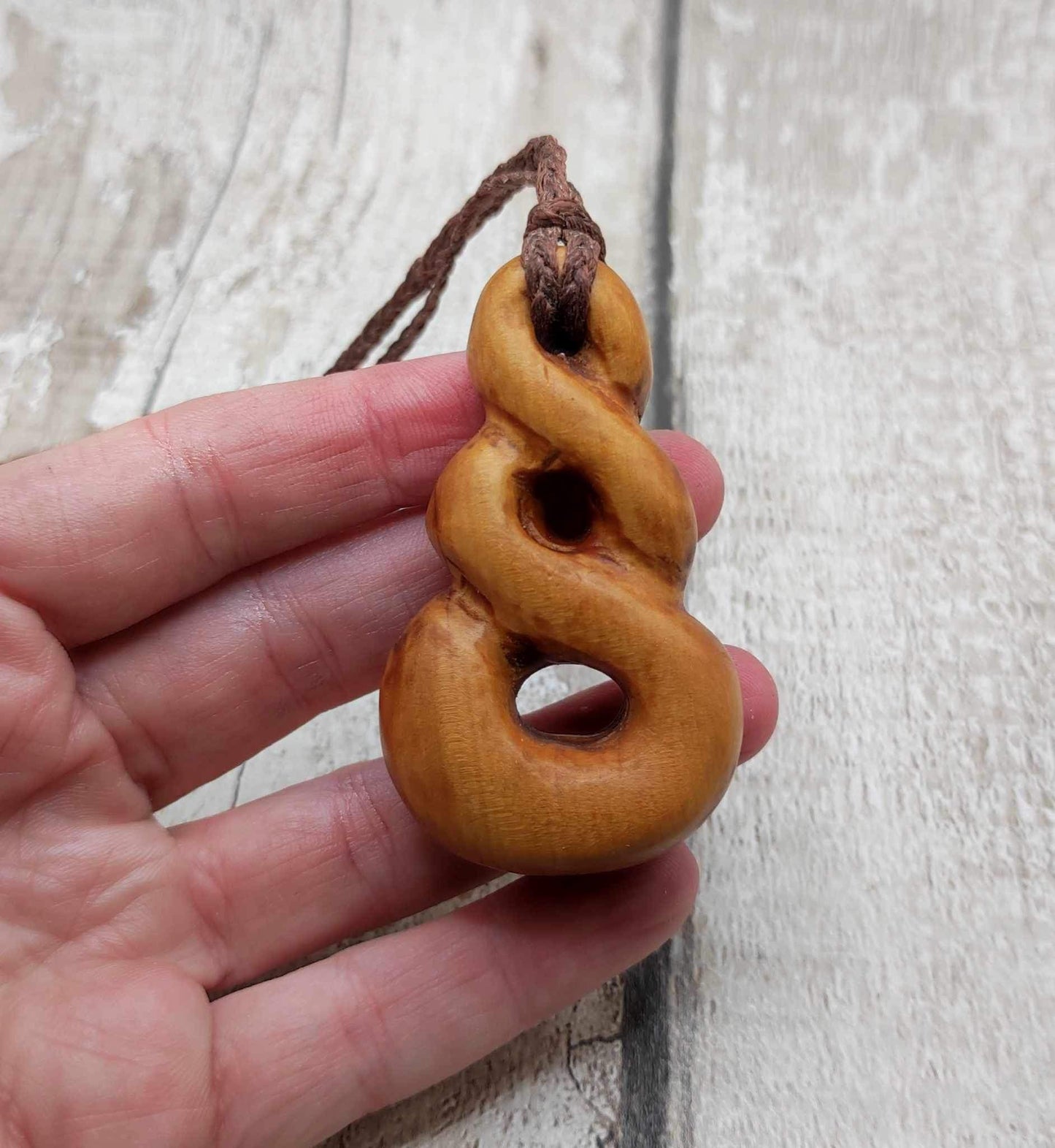 New Zealand Rimu wood pink ours infinity pendant.