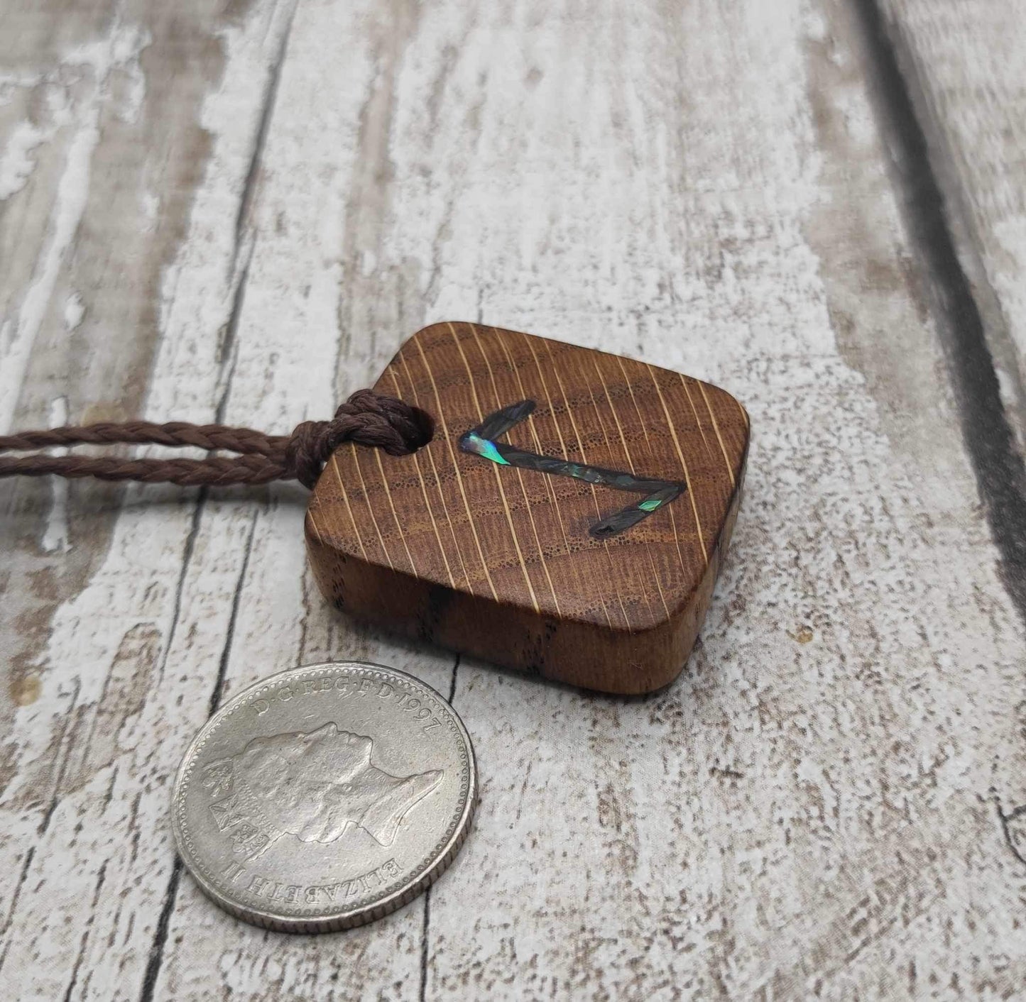 Eihwaz oak wood rune pendant with Pāua shell inlay.