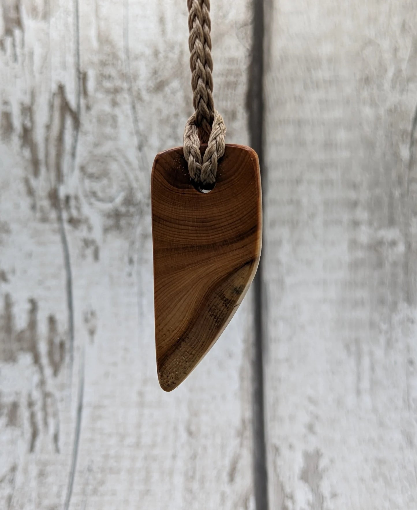 Yew wood slice pendant.