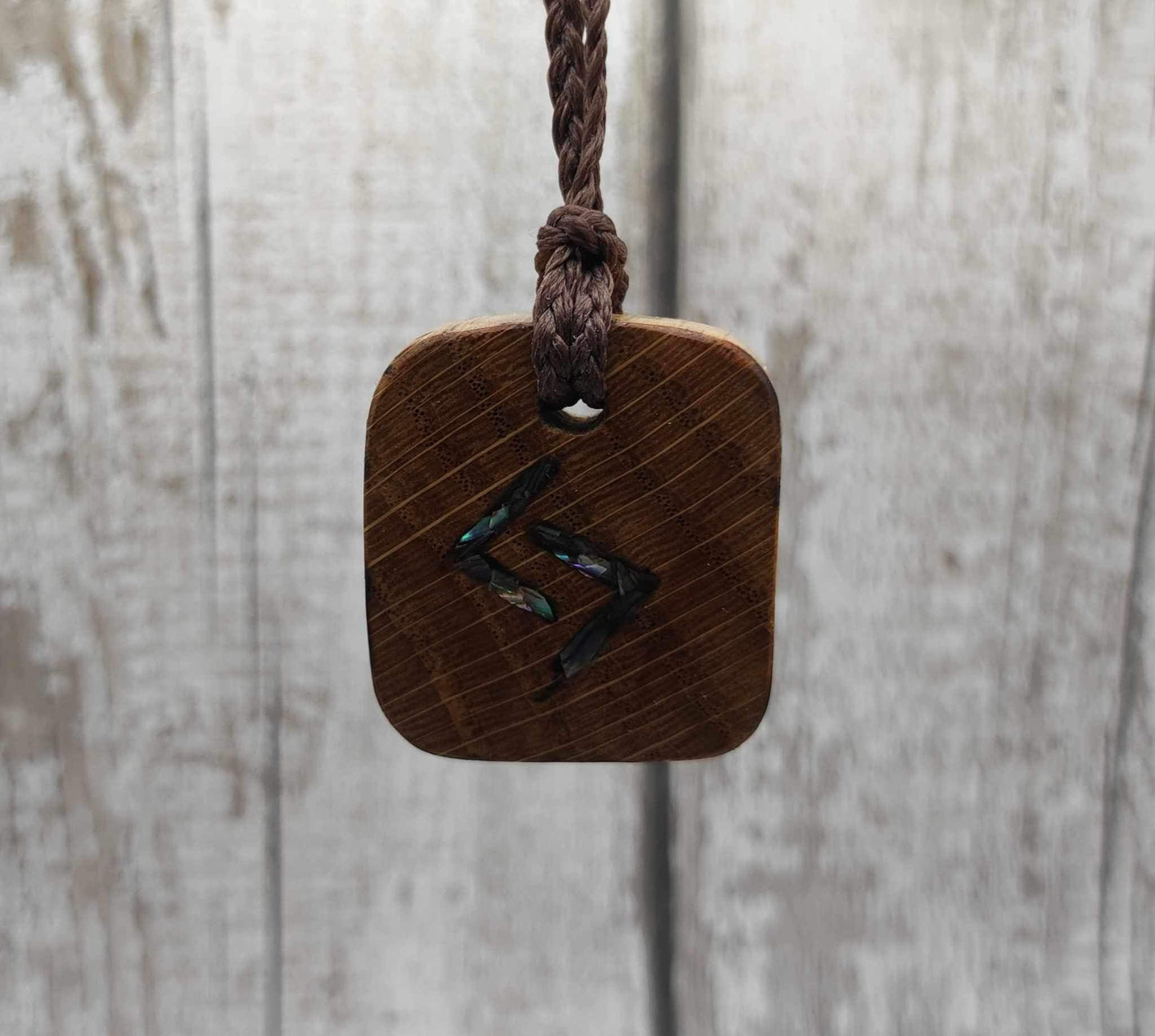 Oak wood jera Viking rune Christmas decoration with Pāua shell.