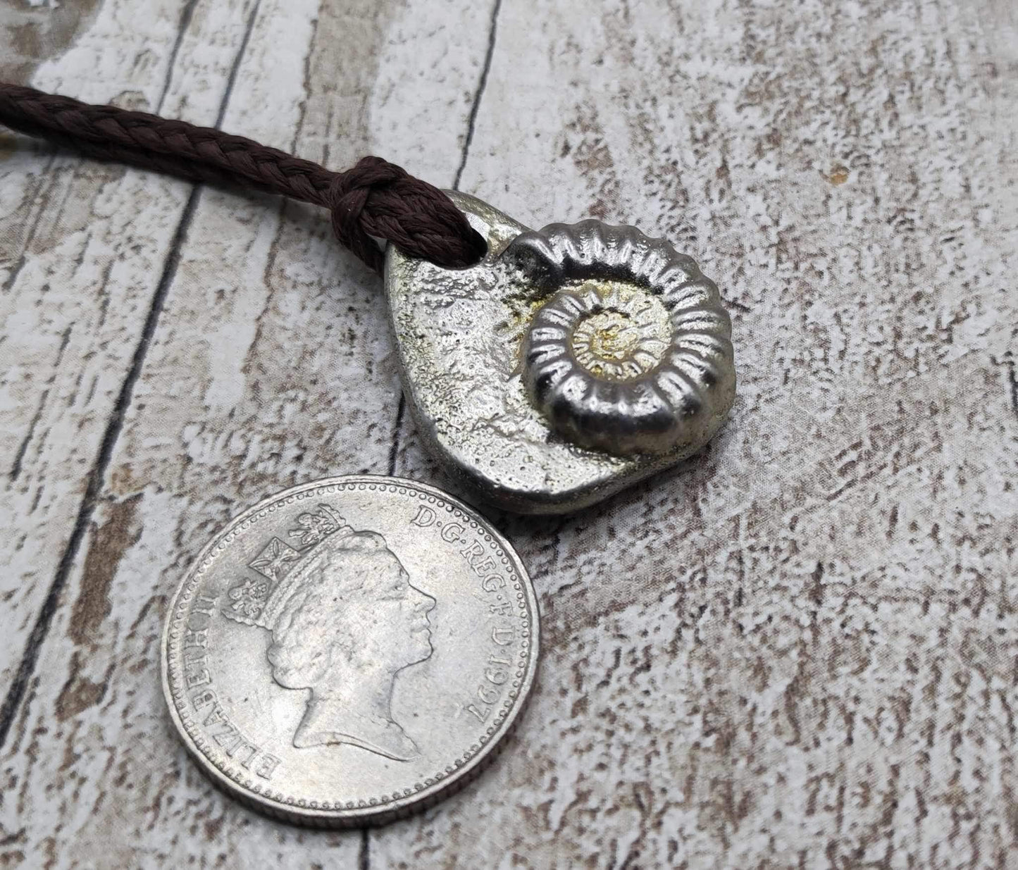 Pewter metal cast ammonite pendant.