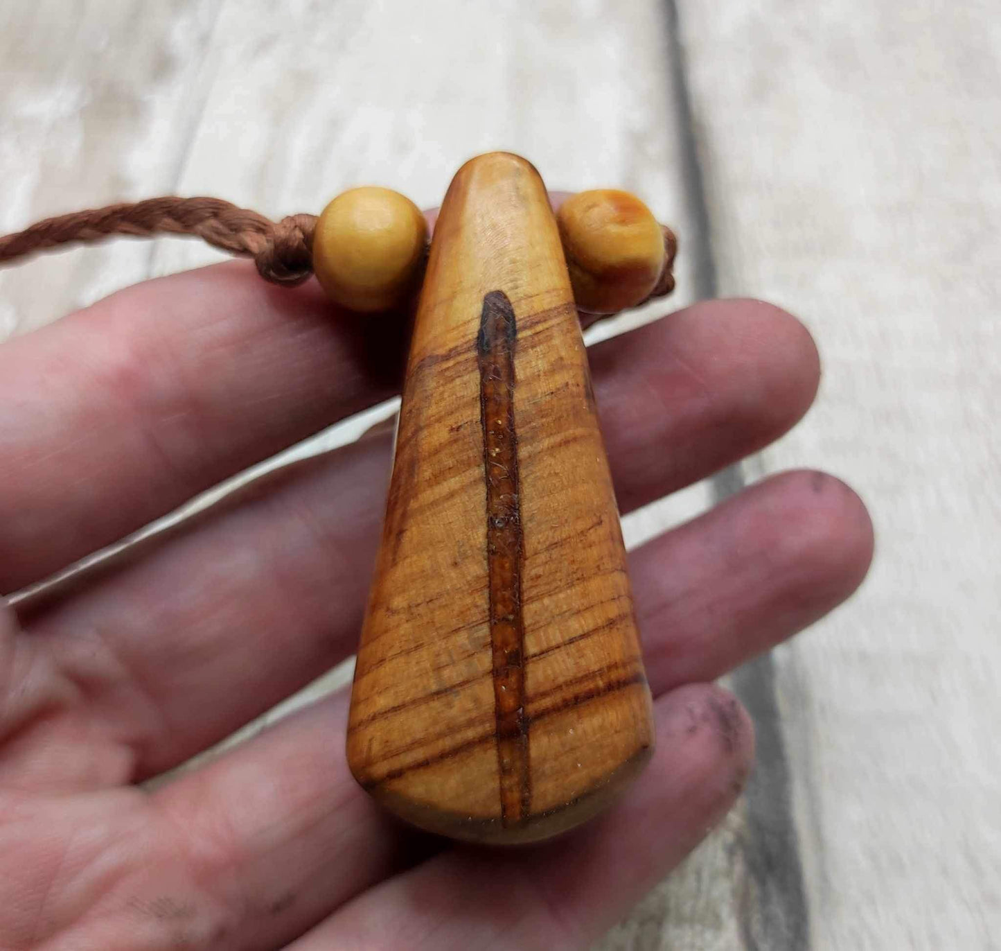 New Zealand Rimu wood and kauri copal gum pendant