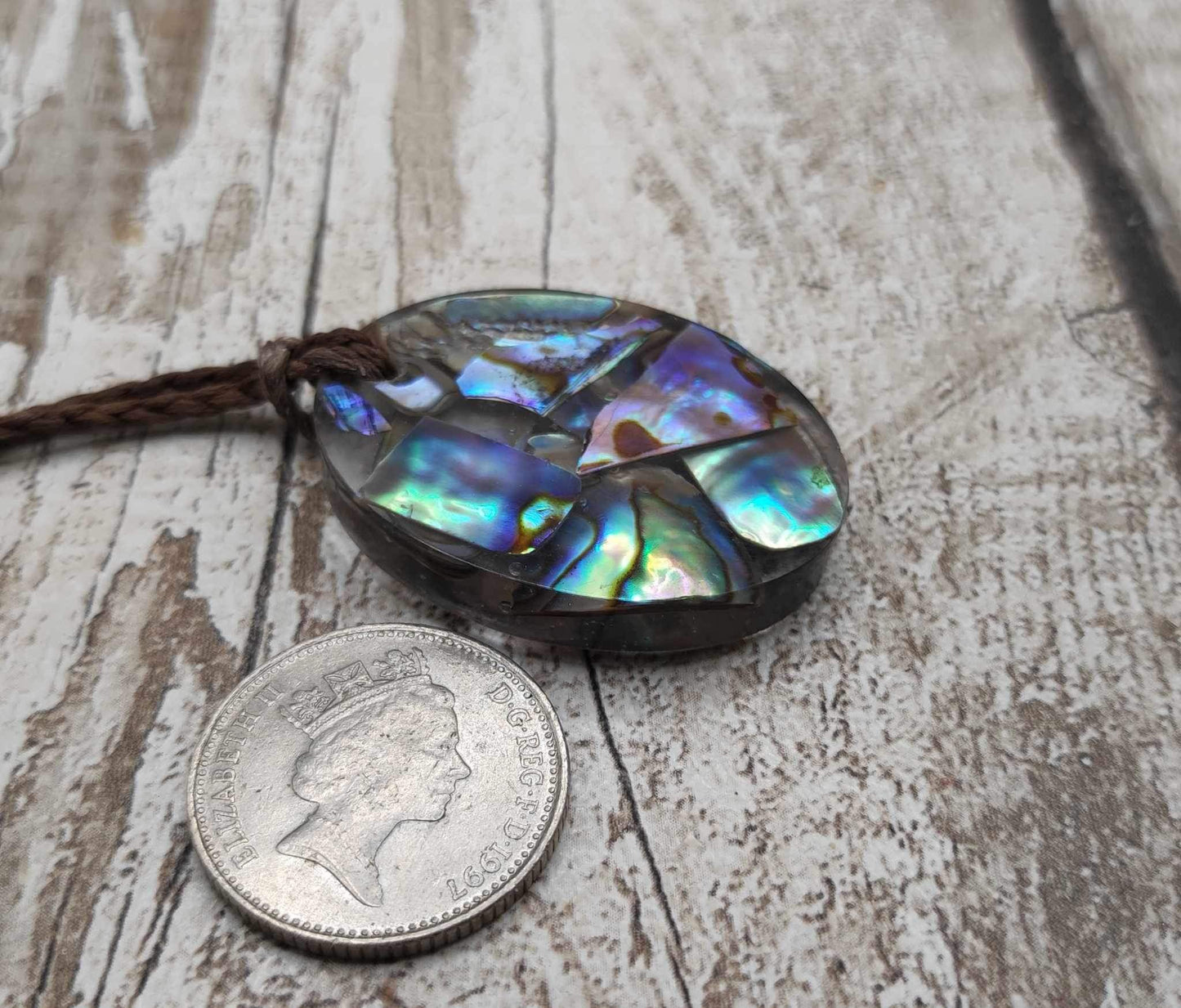 New Zealand Pāua in UV resin pendant.