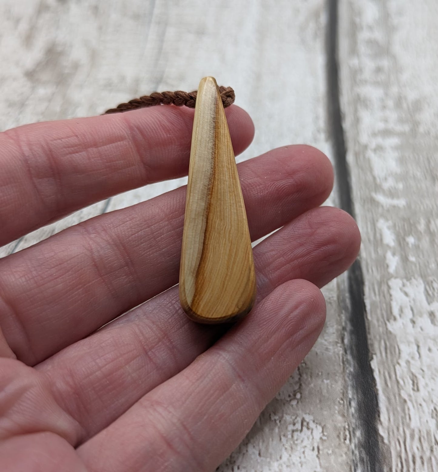 Yew wood roimata drop pendant.