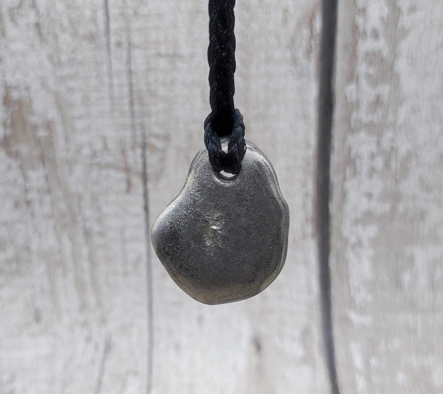 Solid pewter ammonite cast pendant.