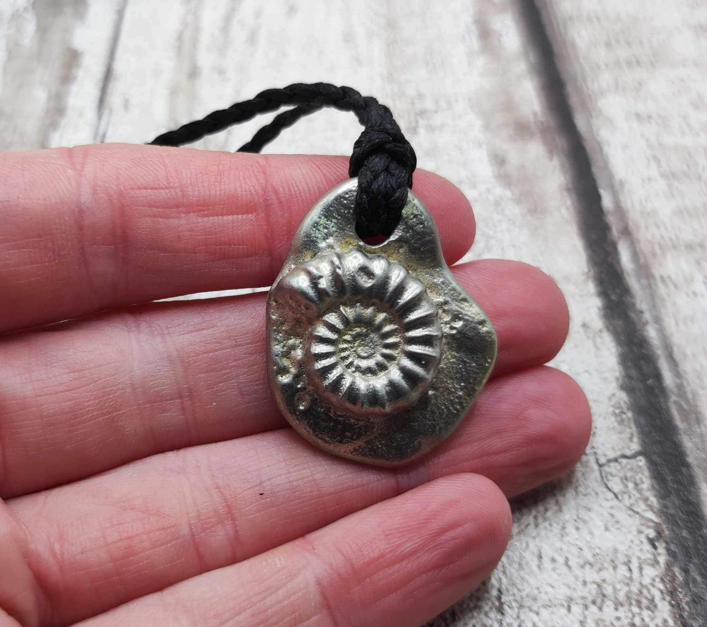 Solid pewter ammonite cast pendant.