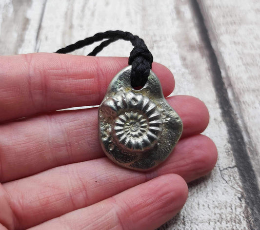 Solid pewter ammonite cast pendant.