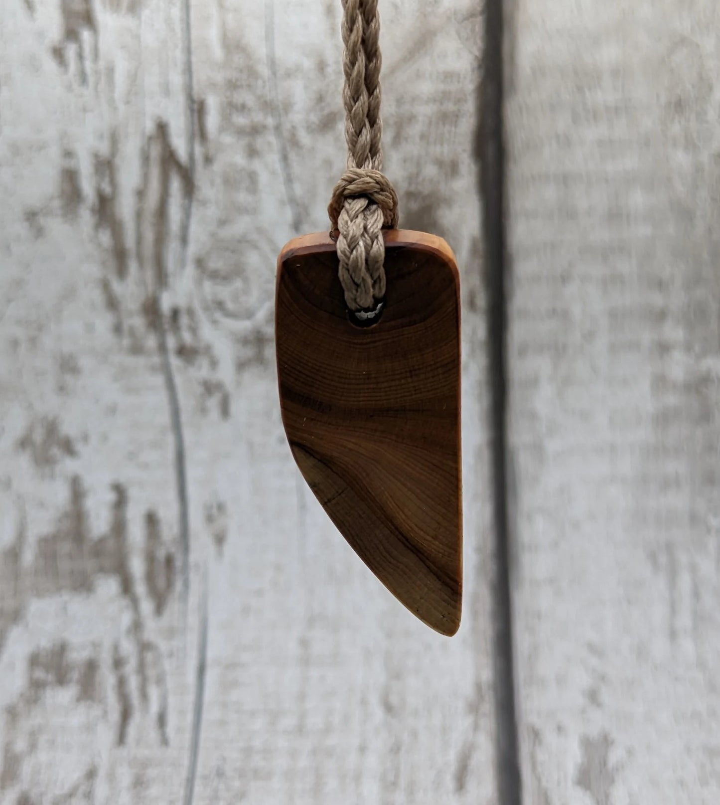 Yew wood slice pendant.