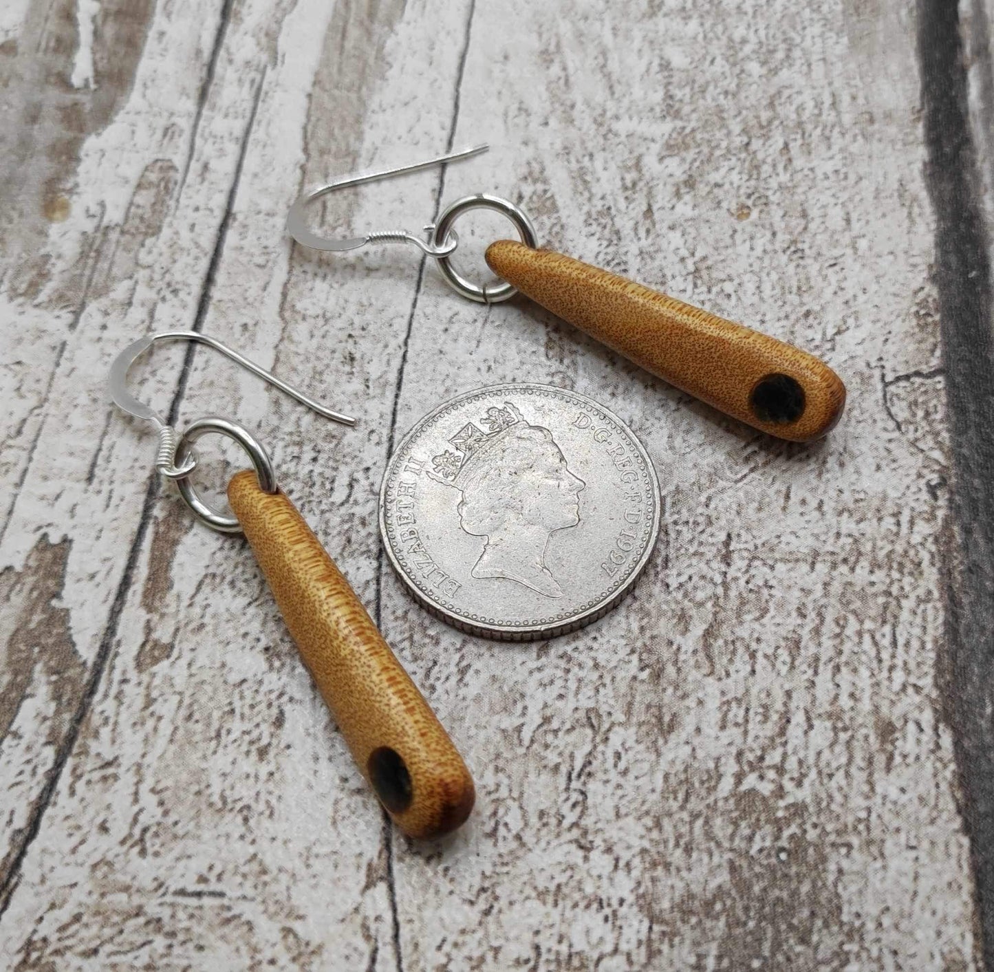 New Zealand swamp kauri wood, roimata earrings, with serpentine Pounamu inlay.