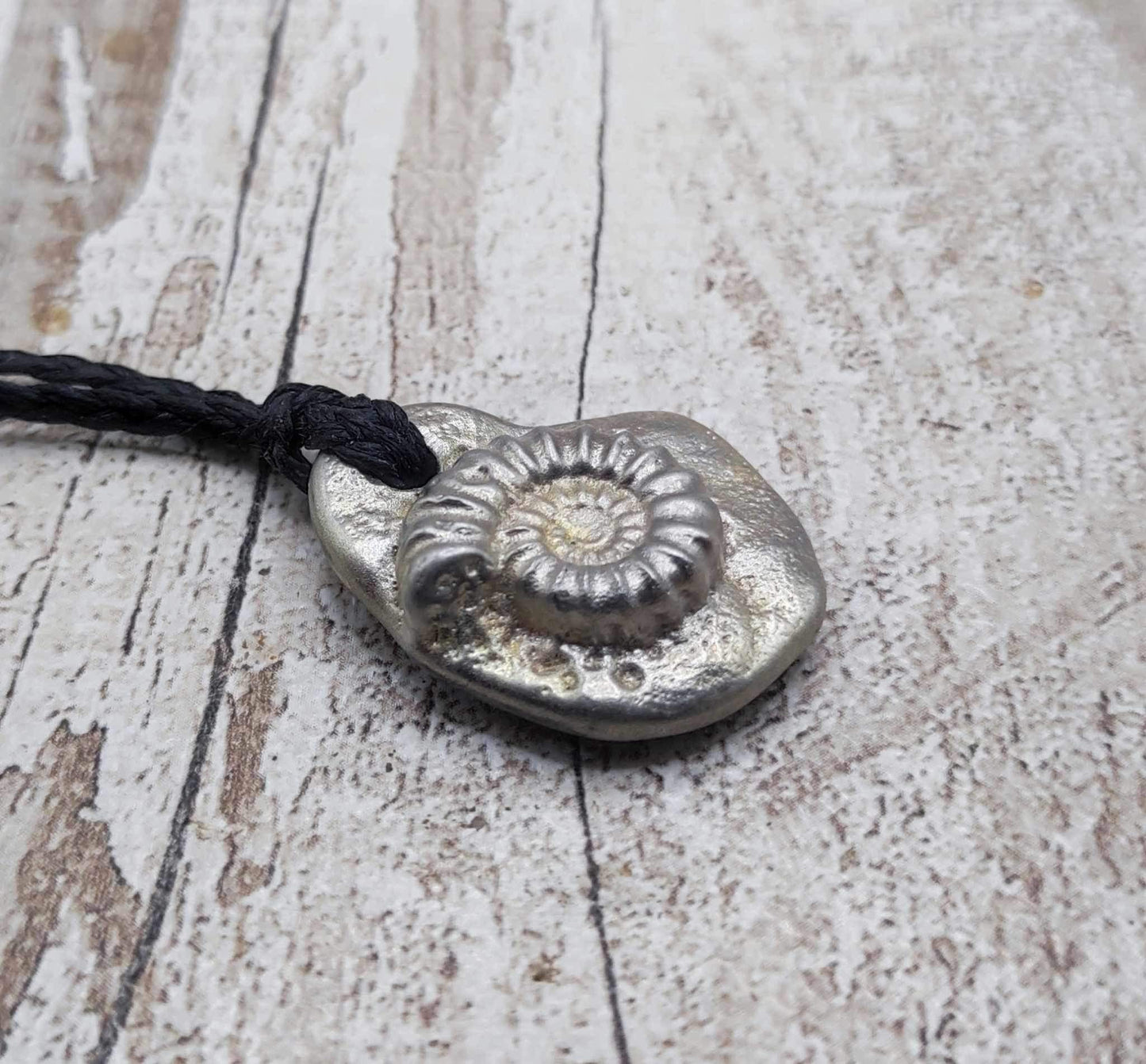 Solid pewter ammonite cast pendant.