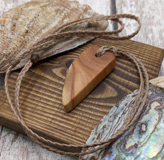 Yew wood slice pendant.