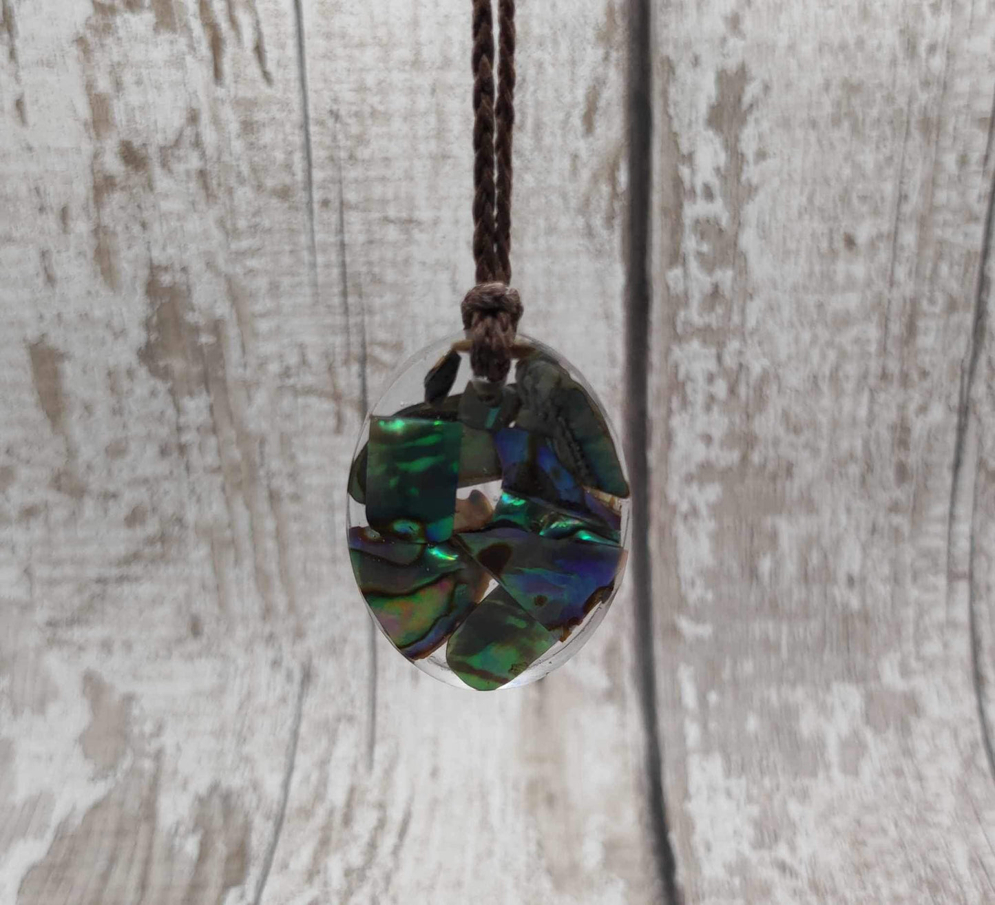 New Zealand Pāua in UV resin pendant.