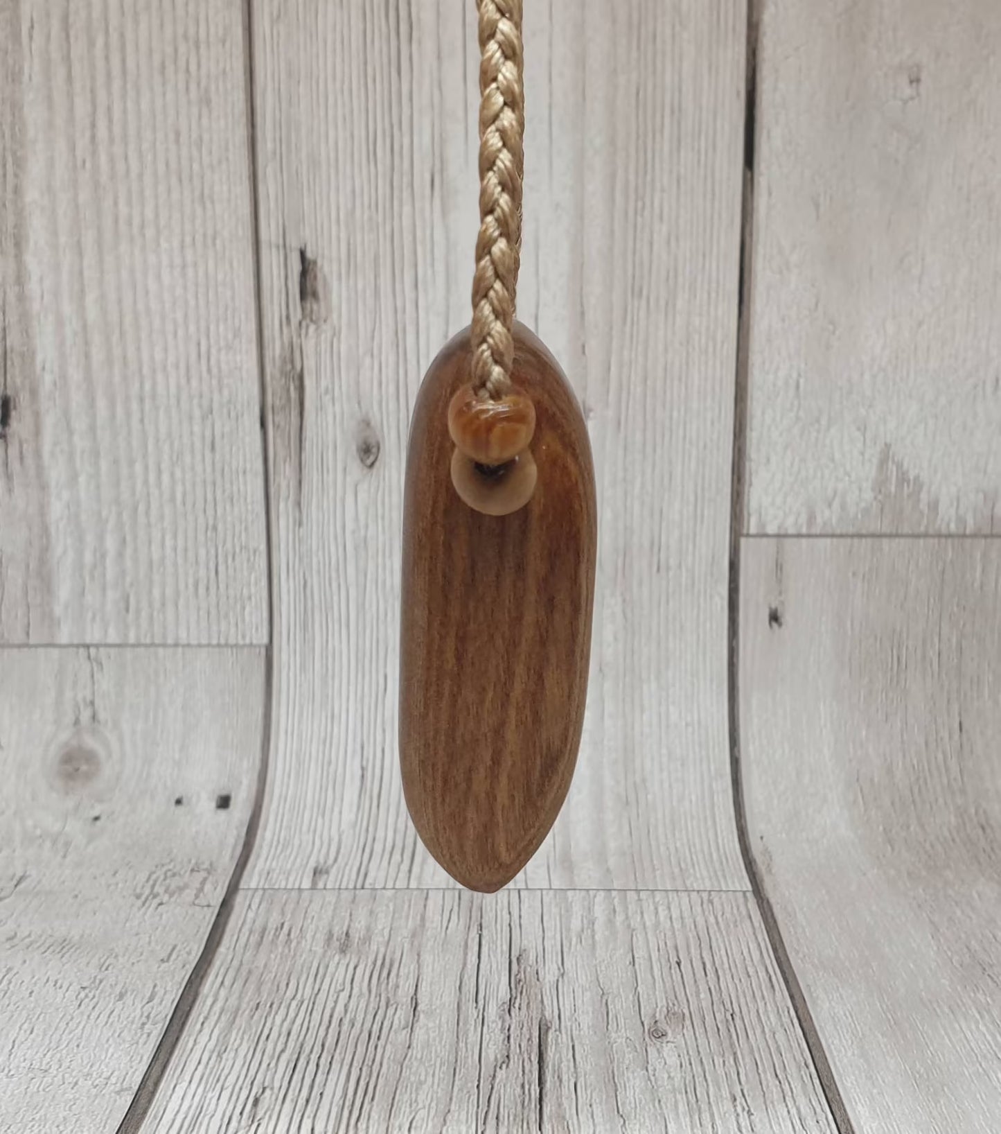 New Zealand Rimu wood adze inspired pendant.