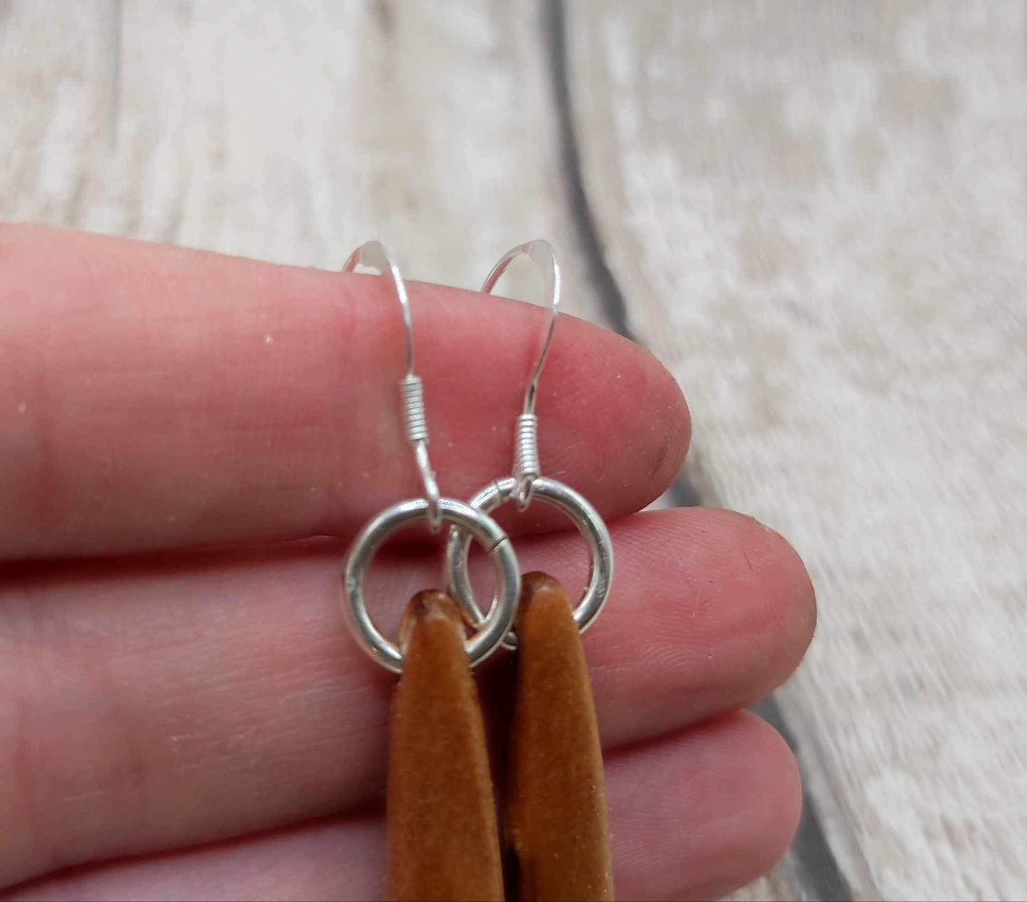 New Zealand swamp kauri wood, roimata earrings, with serpentine Pounamu inlay.