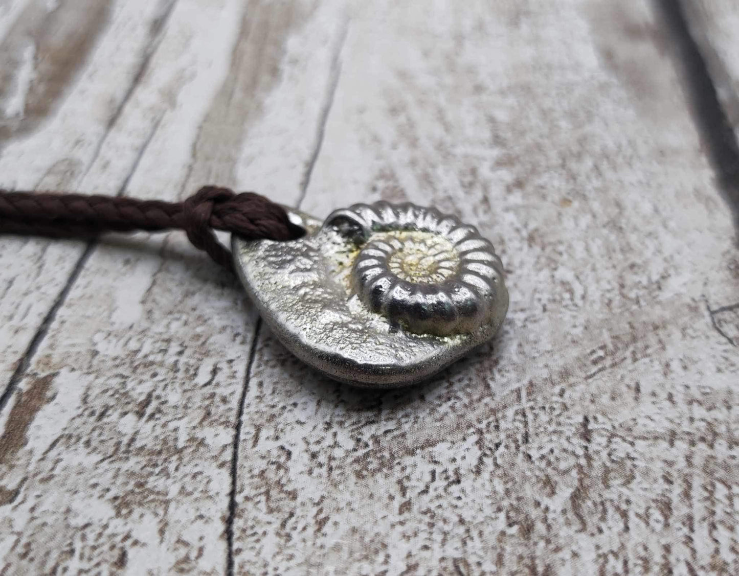 Pewter metal cast ammonite pendant.