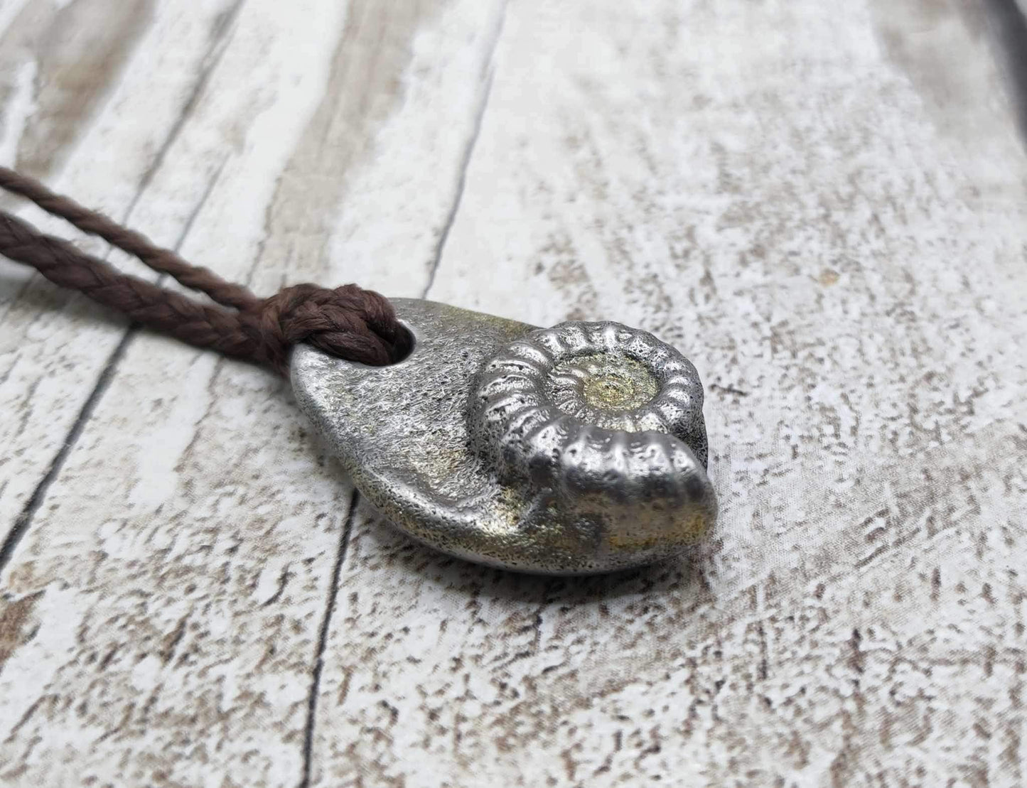 Pewter metal casting ammonite spiral pendant.