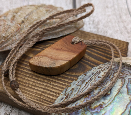 Yew wood slice pendant.