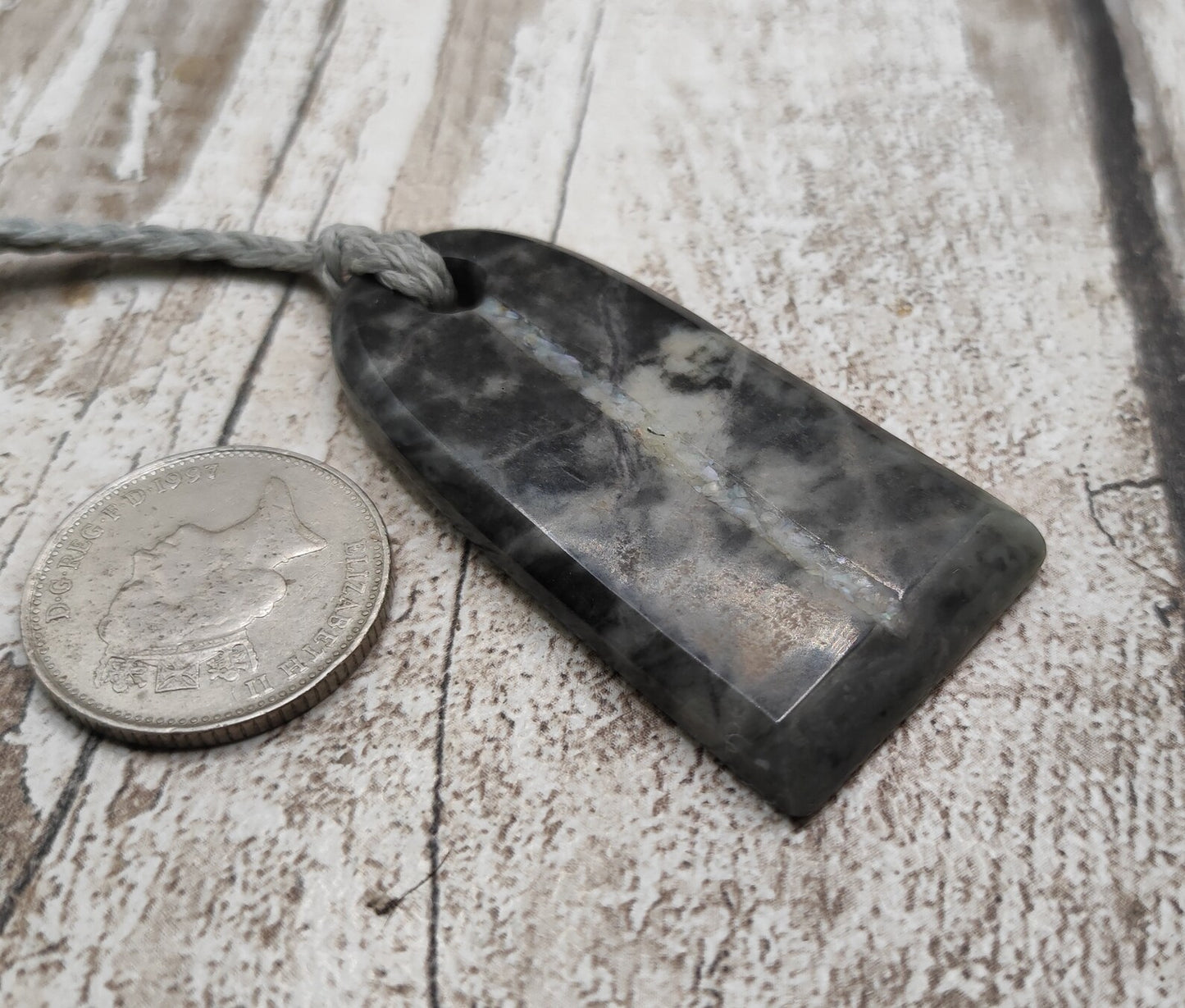 Alaskan nephrite jade Toki styled pendant with mussel shell inlay.