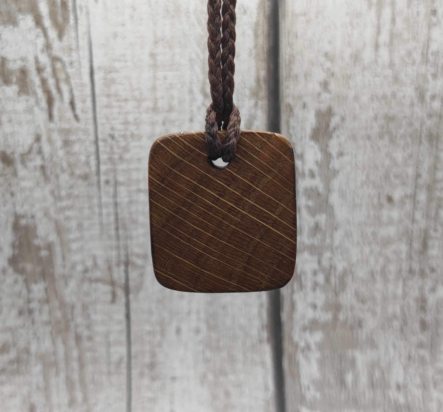 Eihwaz oak wood rune pendant with Pāua shell inlay.
