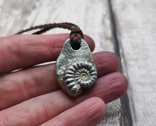 Pewter metal casting ammonite spiral pendant.