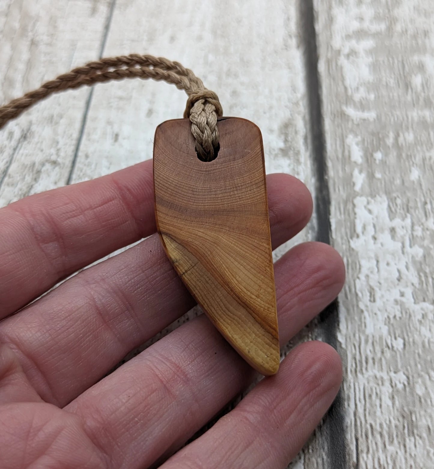 Yew wood slice pendant.