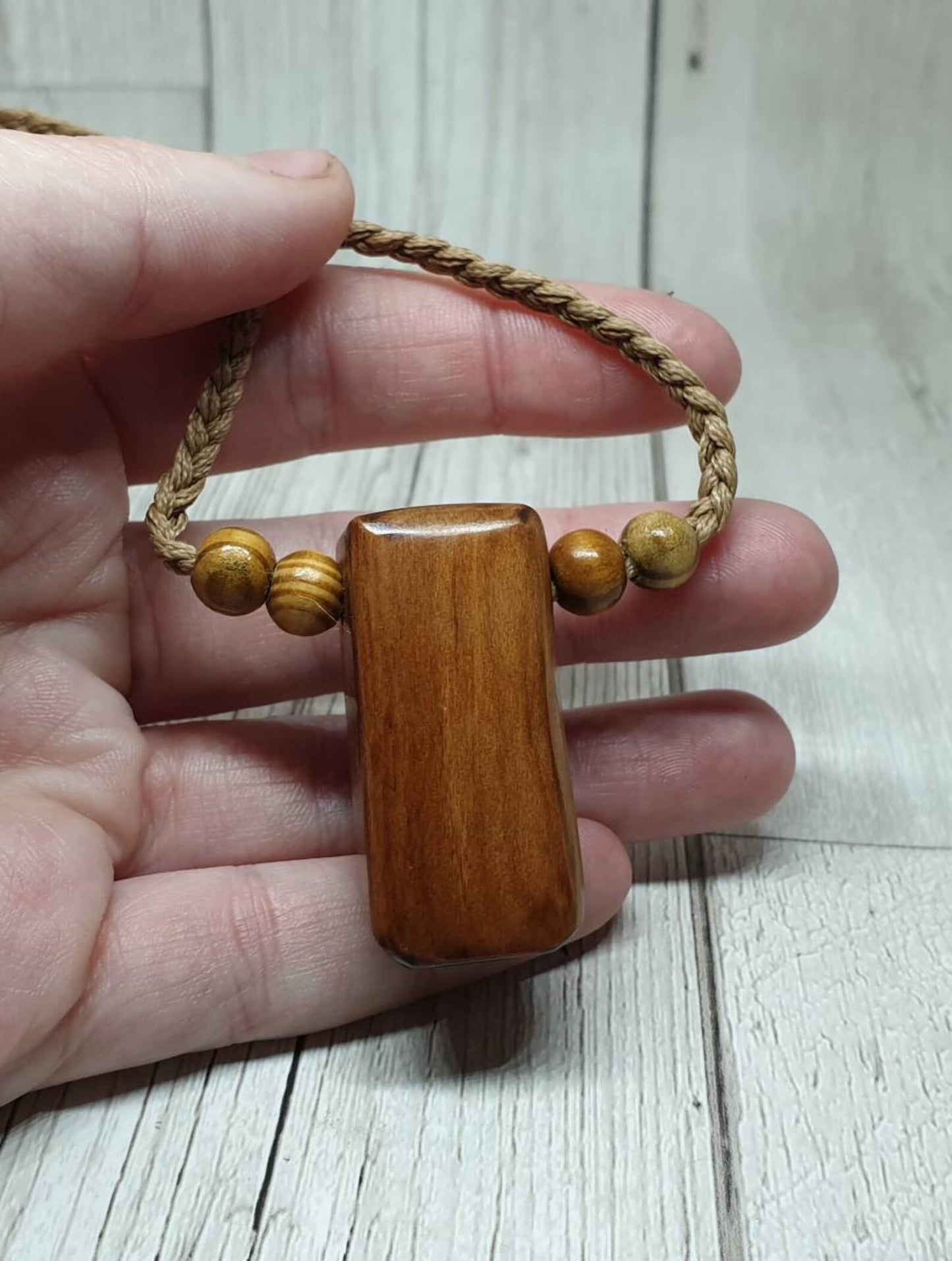 New Zealand Rimu wood unisex pendant.