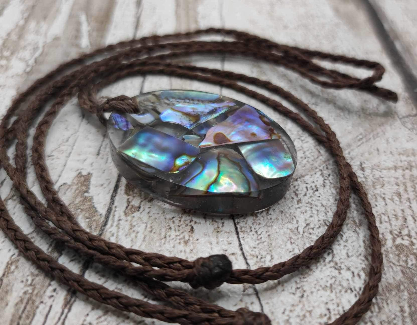 New Zealand Pāua in UV resin pendant.