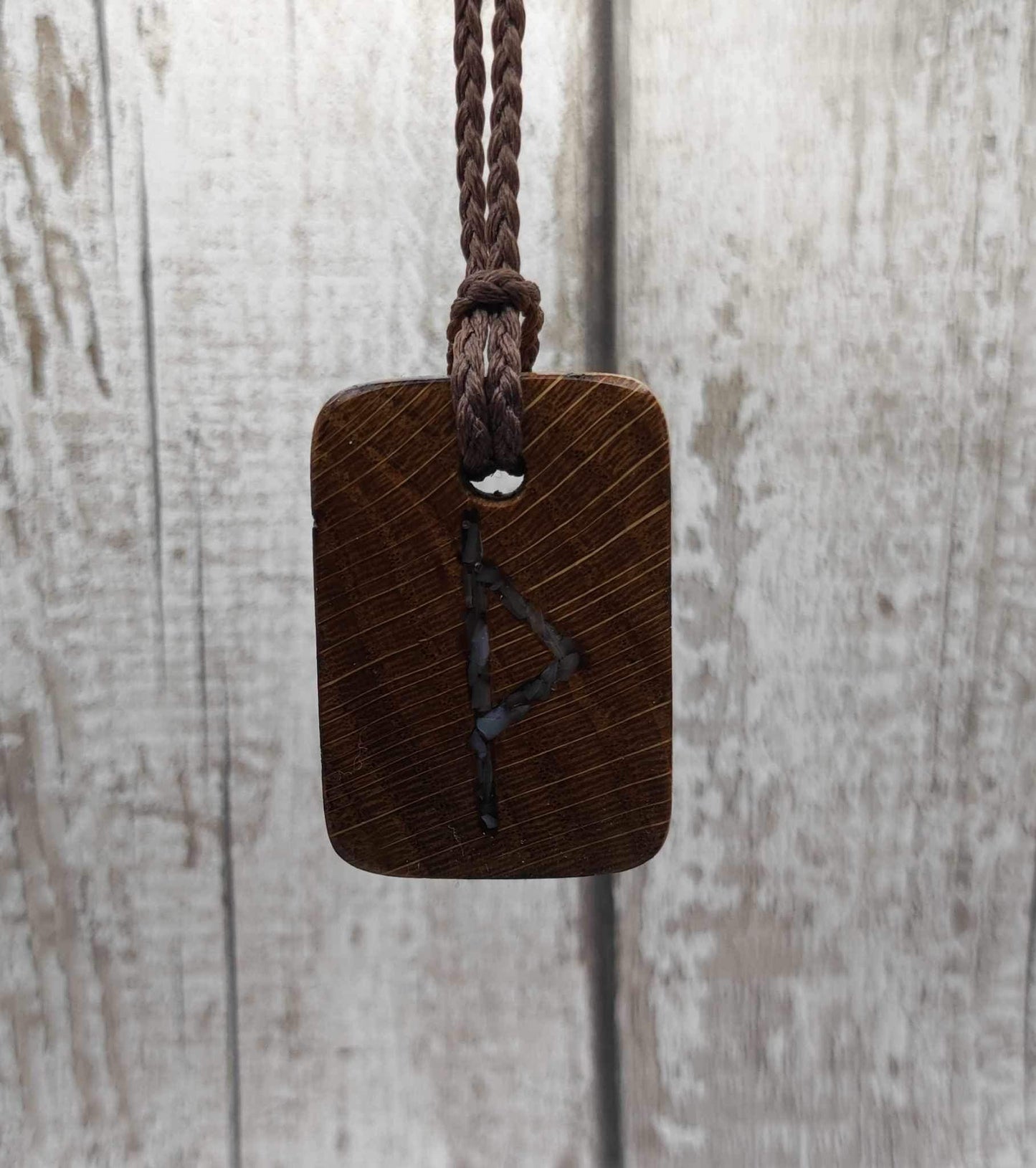 Wunjo oak wood rune pendant with mussel shell inlay.
