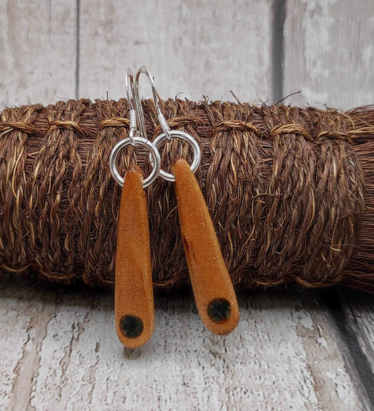 New Zealand swamp kauri wood, roimata earrings, with serpentine Pounamu inlay.