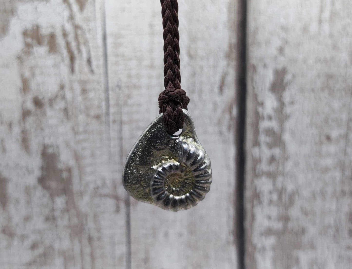 Pewter metal cast ammonite pendant.