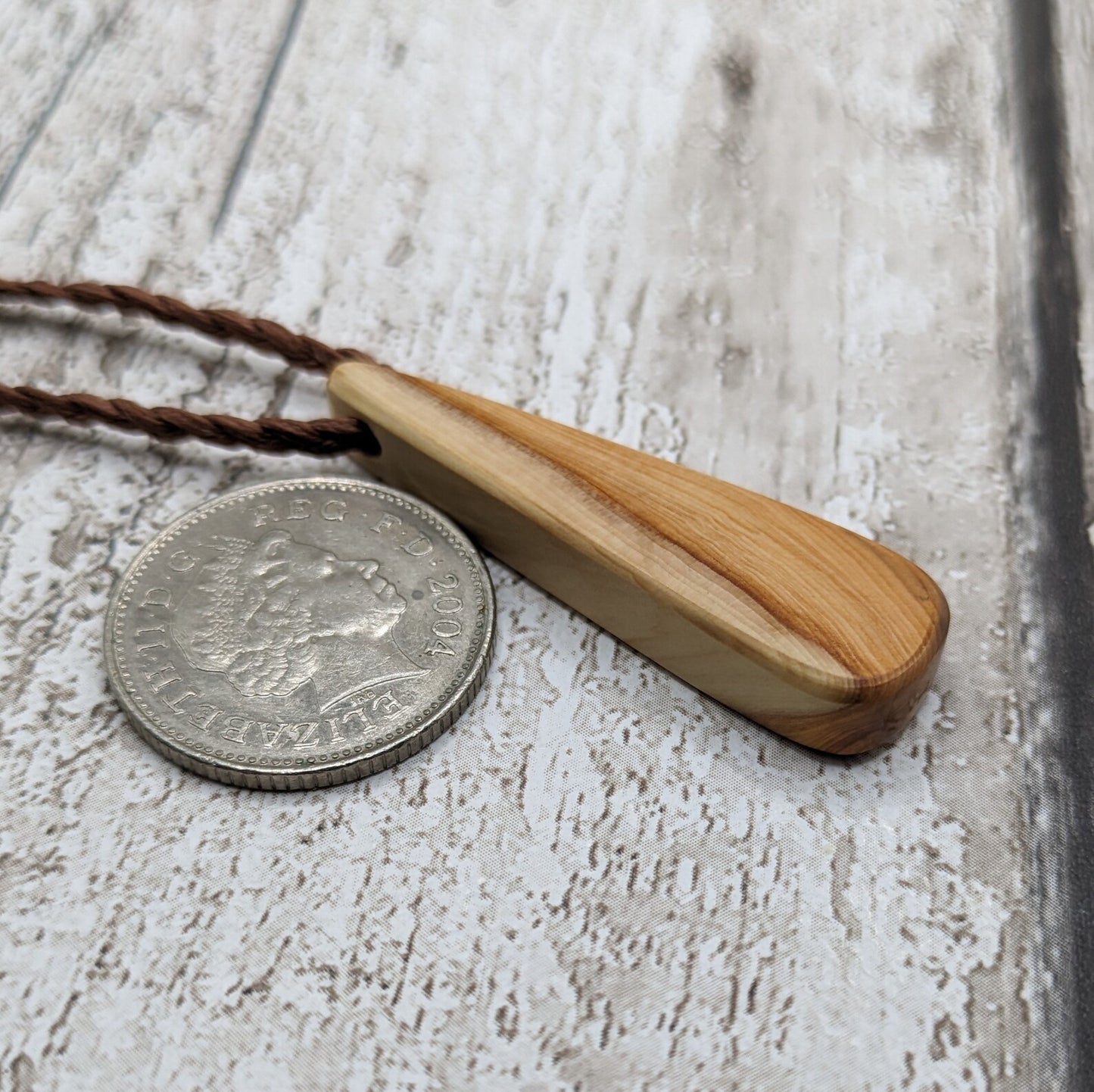 Yew wood roimata drop pendant.