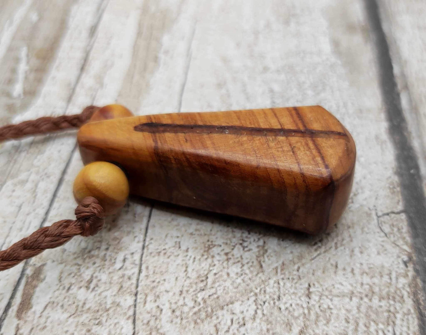 New Zealand Rimu wood and kauri copal gum pendant